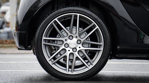 Free Close-up Photograph of Chrome Vehicle Wheel Stock Photo